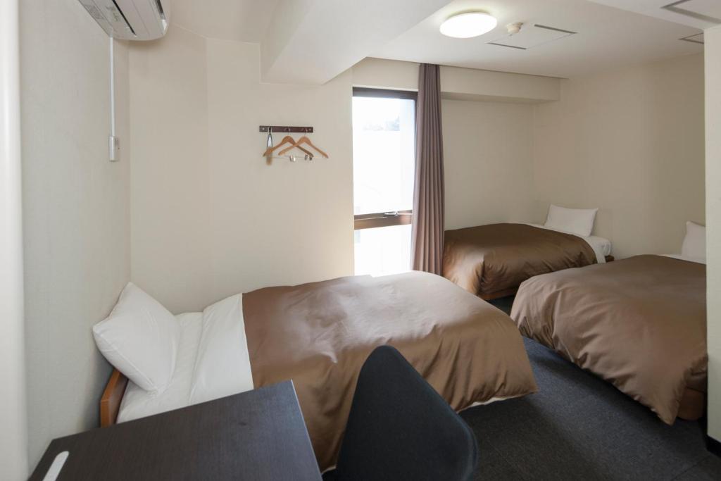 Hotel Plaza Inn Tokushima Ruang foto
