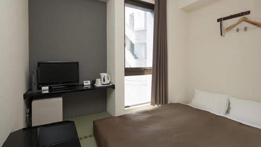 Hotel Plaza Inn Tokushima Ruang foto